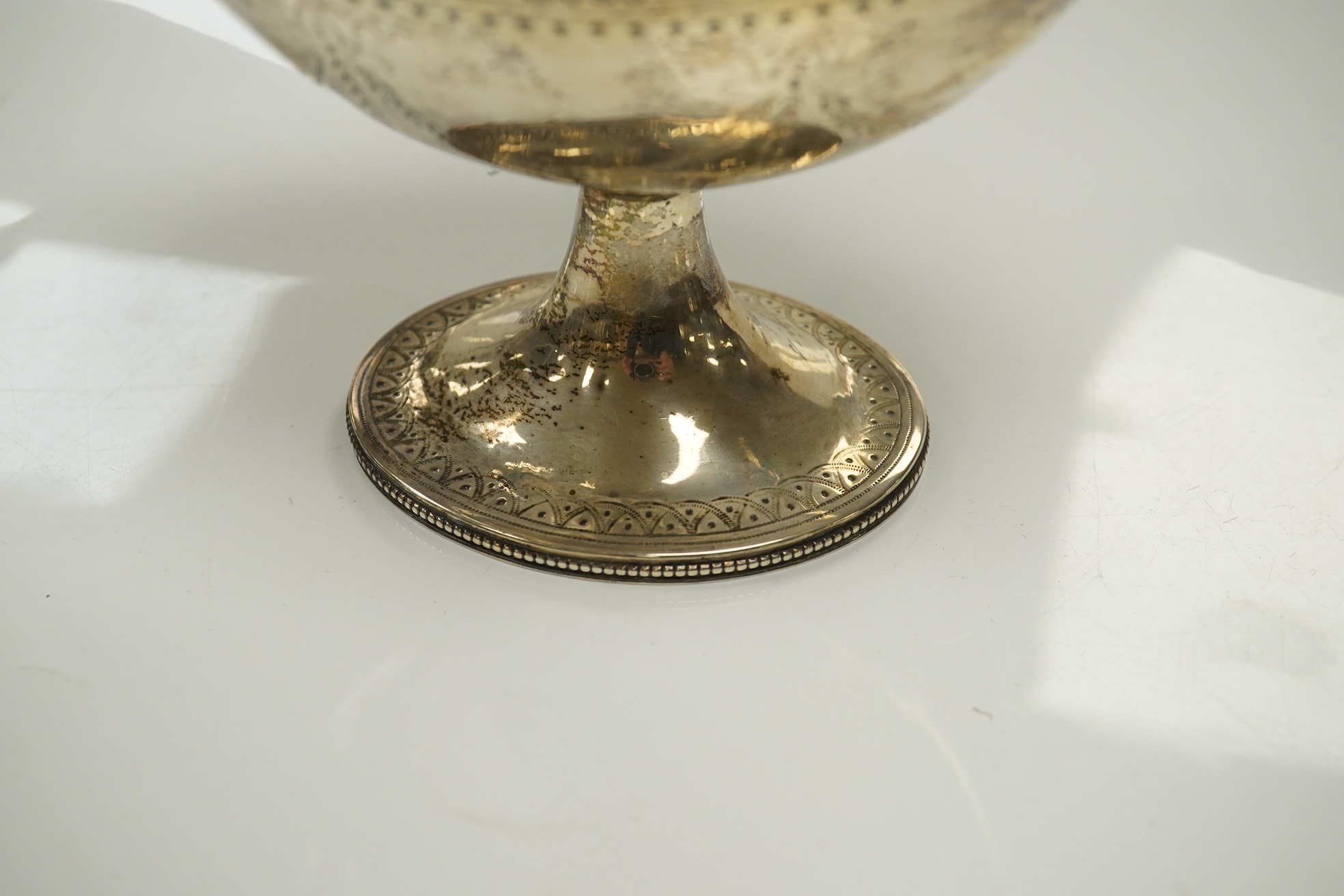 A Victorian engraved silver oval pedestal sugar basket, Henry Holland, London, 1869, width 15.5cm, 7.3oz. Condition - poor